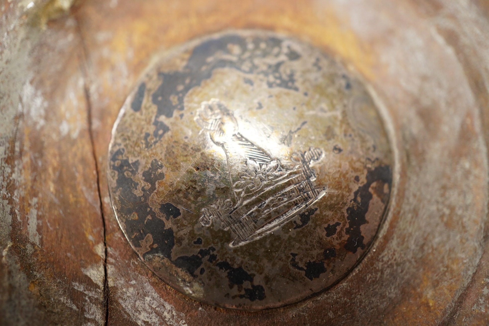 A pair of George III silver wine coasters, by John Roberts & Co, with gadrooned borders and turned wooden bases, Sheffield, 1810, diameter 15.9cm. Condition - poor